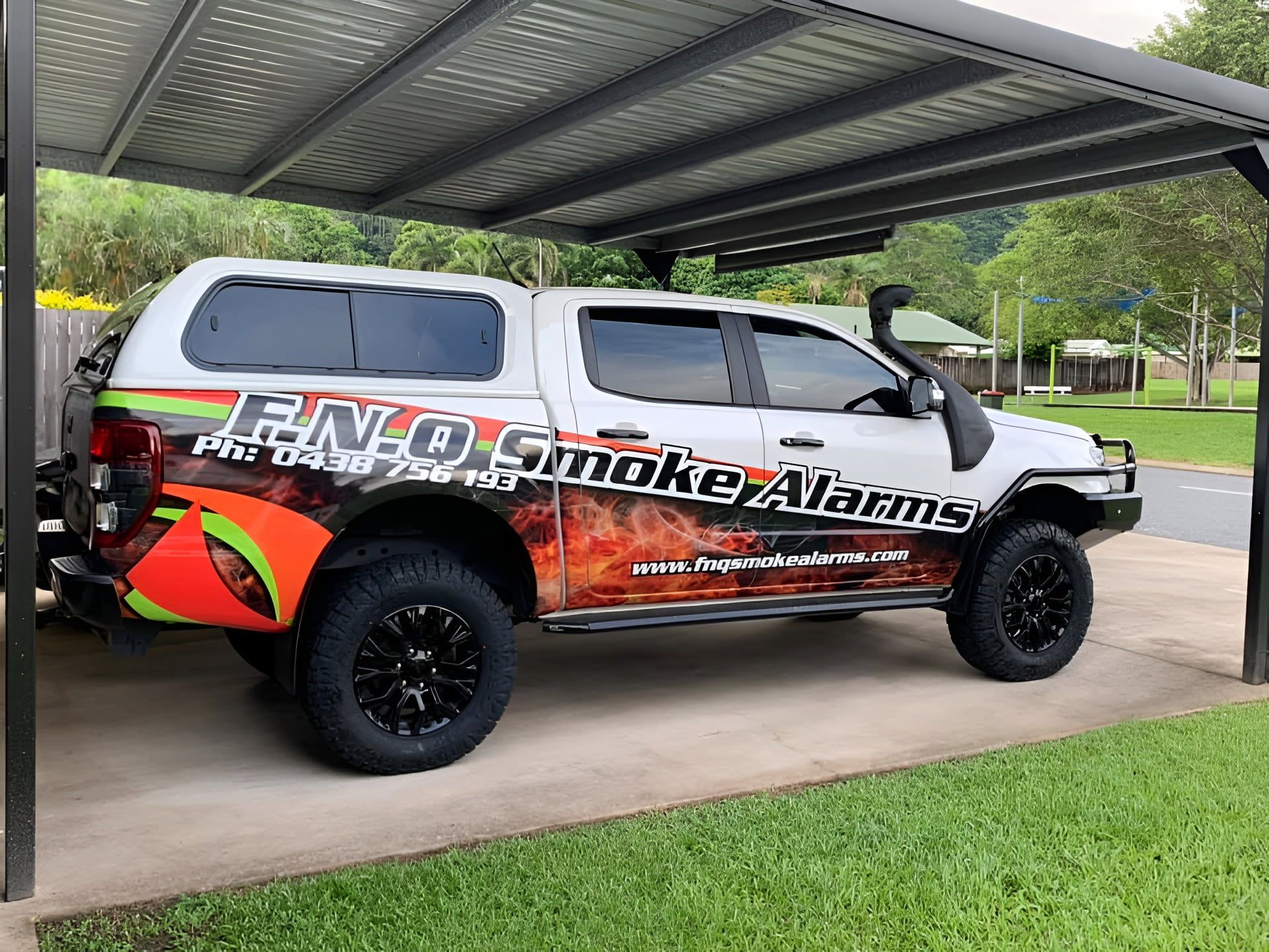 Gray Mazda Pickup Truck With Black Bull Bar Parked on a Driveway — FNQ Smoke Alarms & Maintenance in Goldsborough, QLD