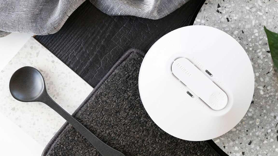 White Round Device With a Rectangular Button — FNQ Smoke A