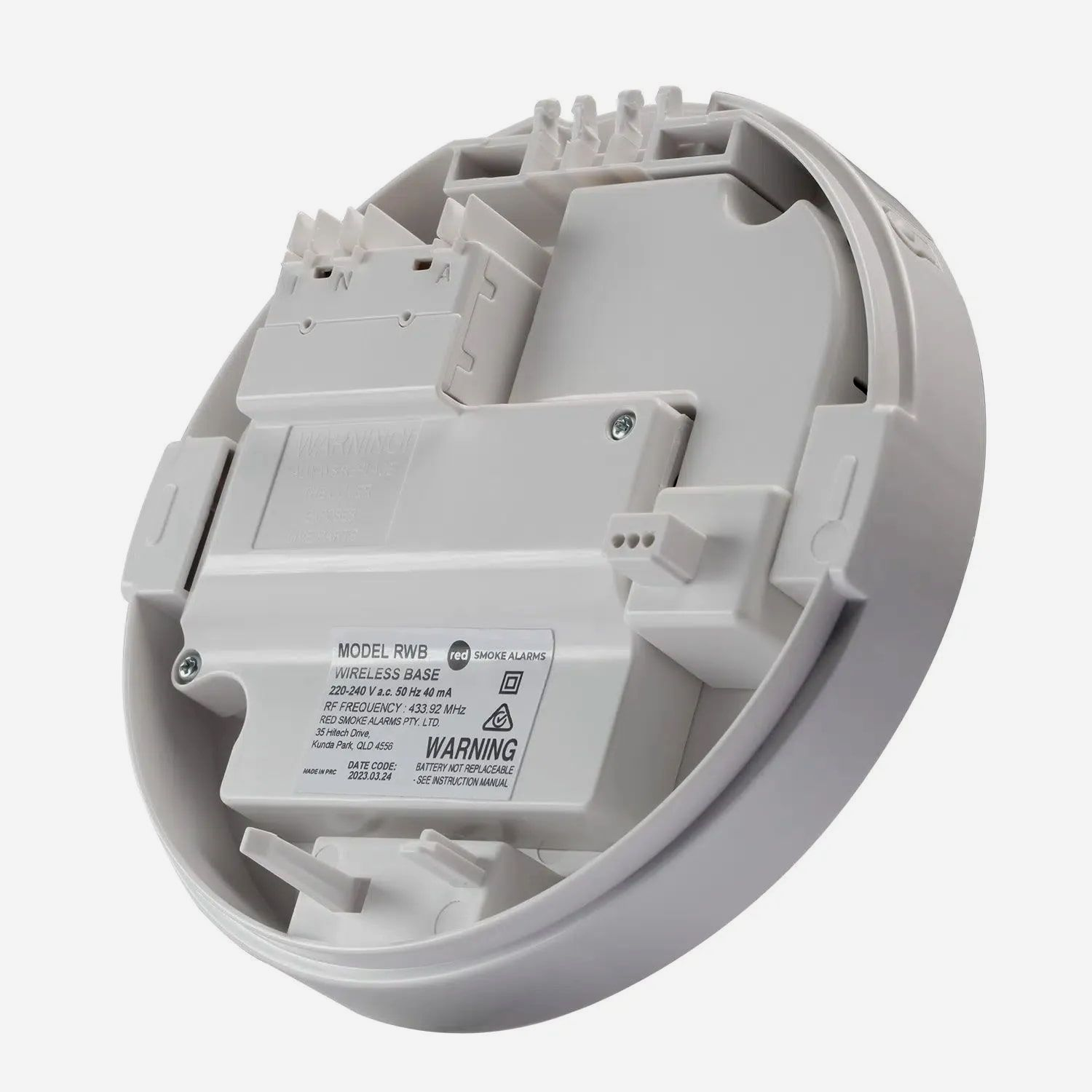 White, Circular Electrical Device Interior With Wire Connectors — FNQ Smoke Alarms & Maintenance in Mareeba, QLD