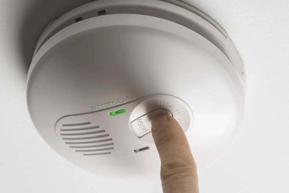 White Smoke Detector With Status Lights and Test Button — FNQ Smoke Alarms & Maintenance in Smithfield, QLD