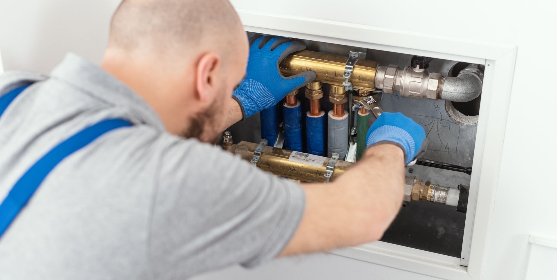 plumber fixing pipes