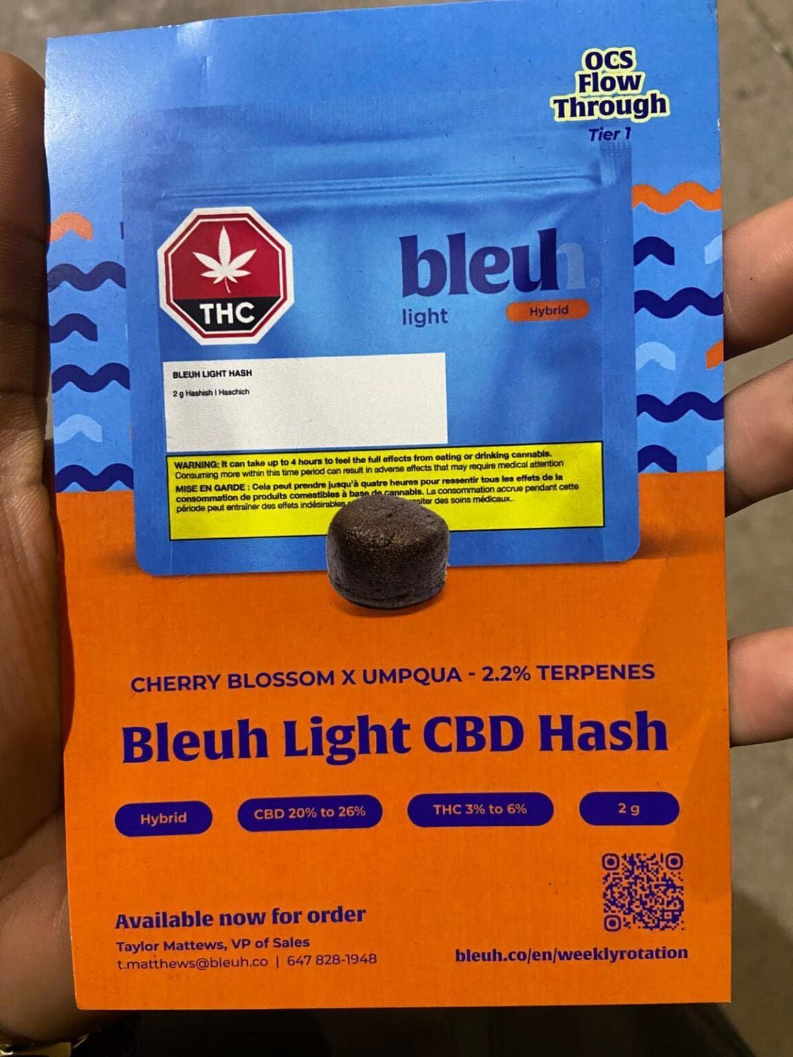 Bleu Light CBD Hash pouch in blue and orange packaging with a black hash puck in front