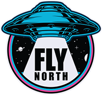 Blue UFO logo with bold “FLY NORTH” text on a black circular background