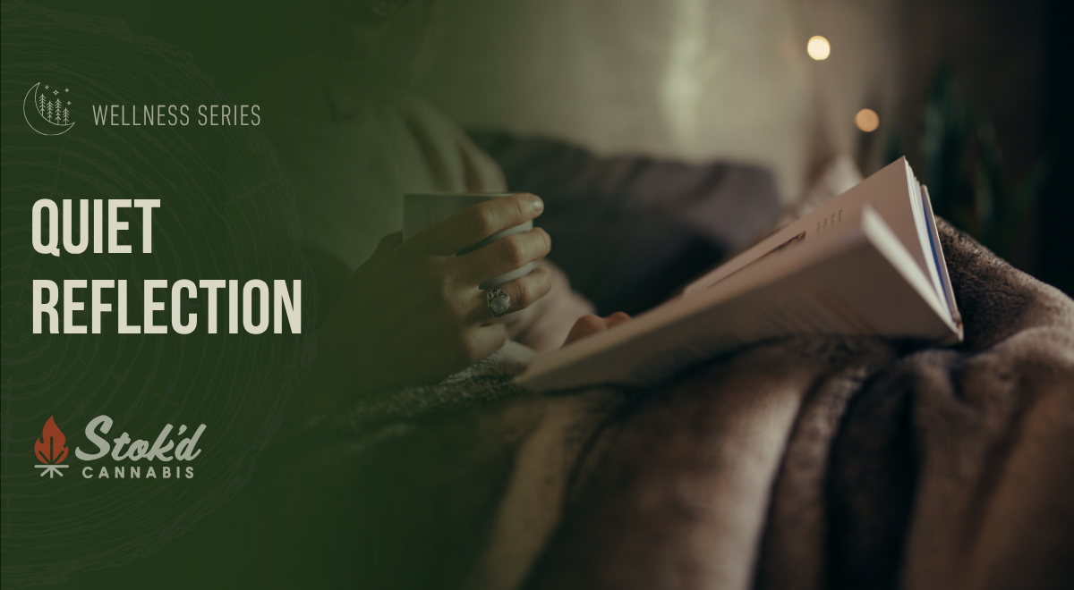 Person reading by string lights with a warm mug, Stok'd Wellness Series banner: Quiet Reflection