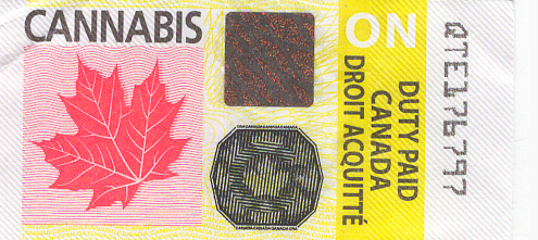 Cannabis label with red leaf, yellow background, and black fingerprint-style security mark