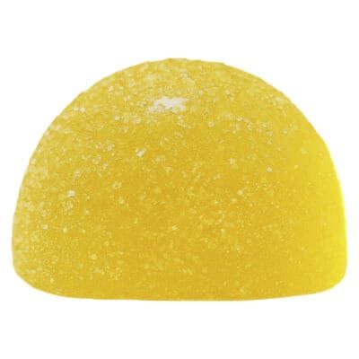 Yellow glittery half-dome dessert or candy on a white background