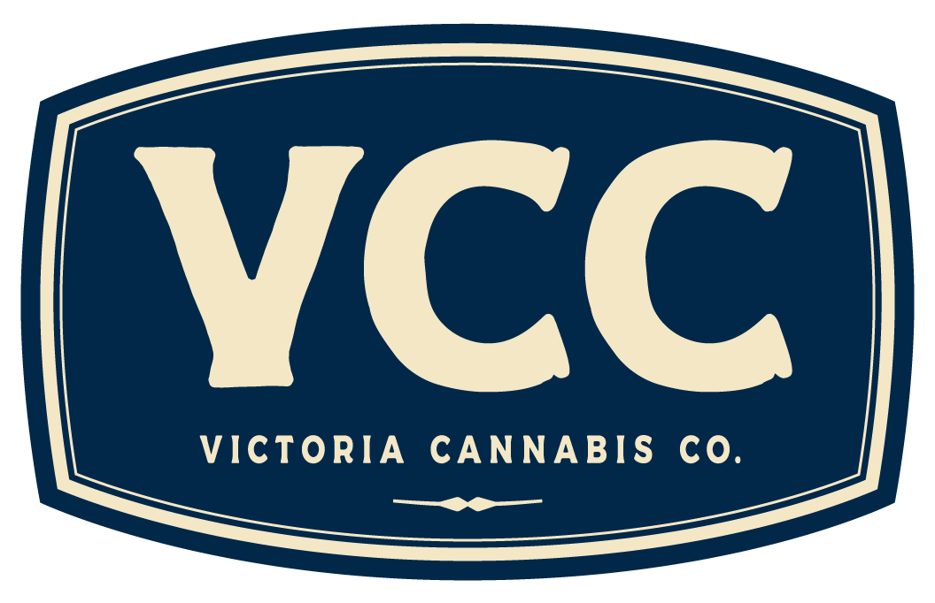 Victoria Cannabis Co. logo in cream on a dark blue badge