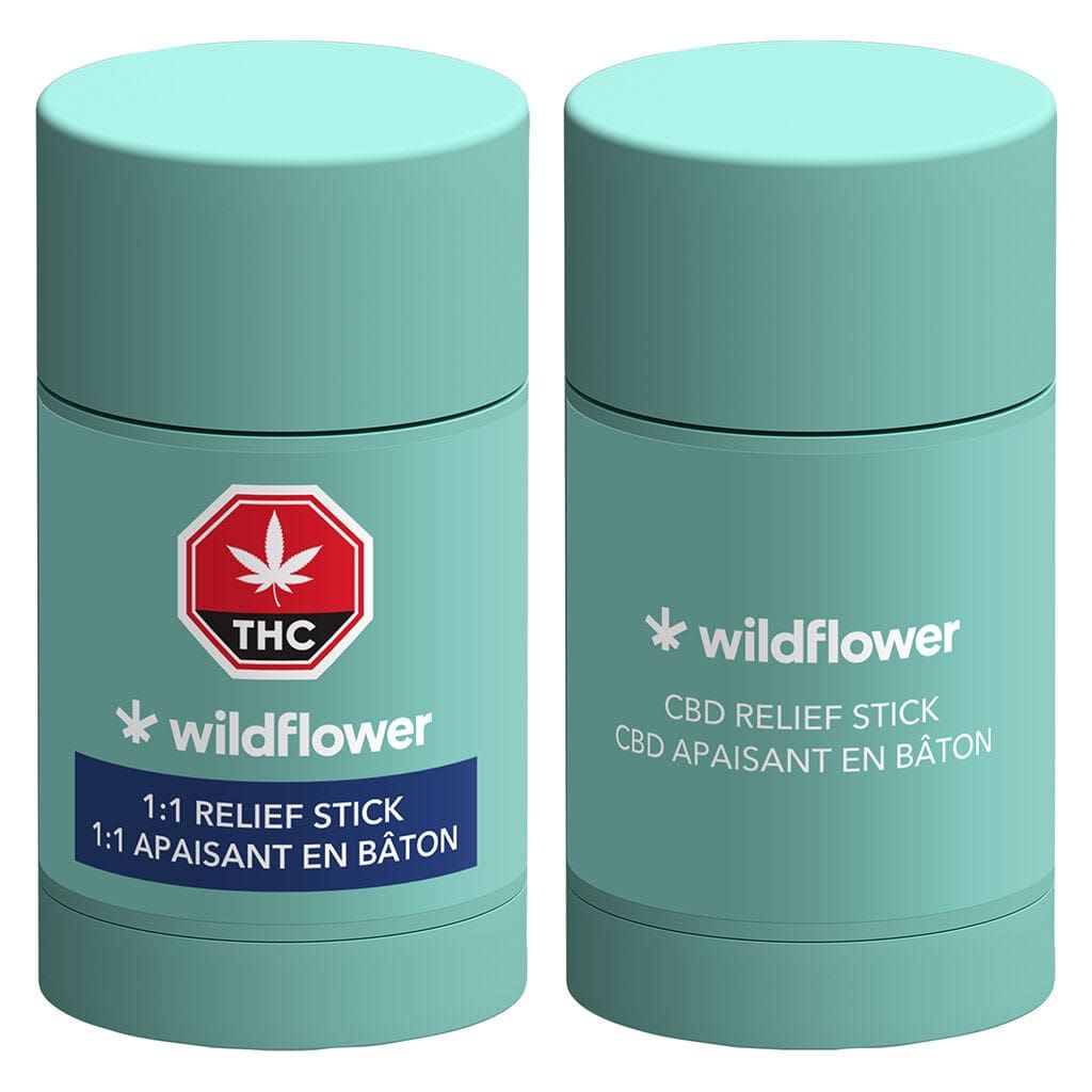 Two mint-green Wildflower CBD relief stick tubes with white labels and THC warning symbol.