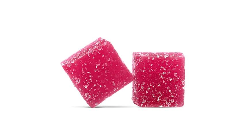 Two pink sugar-coated gummy cubes, one tilted, on a white background