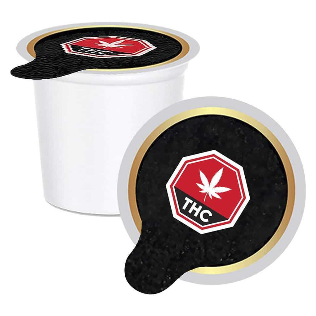 White cup with black THC cannabis leaf labels on lid and side handle.