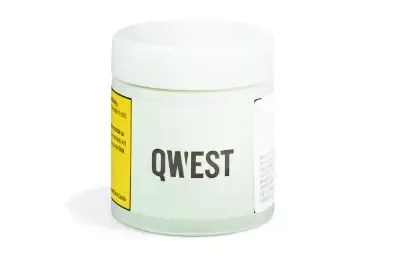 White QWEST jar with a yellow label on a plain background