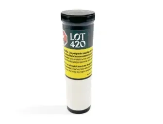 Small cylindrical container with a black cap and yellow label reading “LOT 420” on a white background
