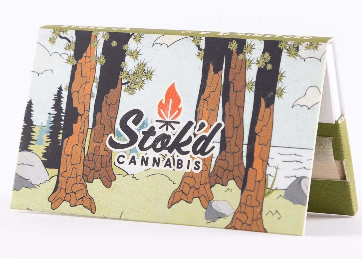 Stoked's Cannabis branded foldable display with tree and mountain artwork in green, white, and orange