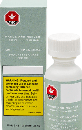 Cannabis oil bottle and box with THC warning label, green and white packaging