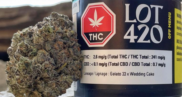 Cannabis bud beside a black LOT 420 THC label with red THC icon and white text.