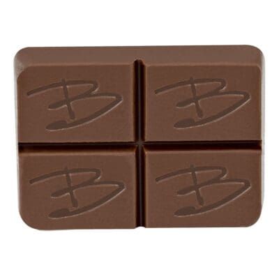 Four-piece milk chocolate bar with embossed letters on each square