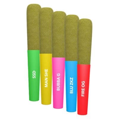 Five cannabis kief-covered pre-rolls with colourful filter tips on a white background