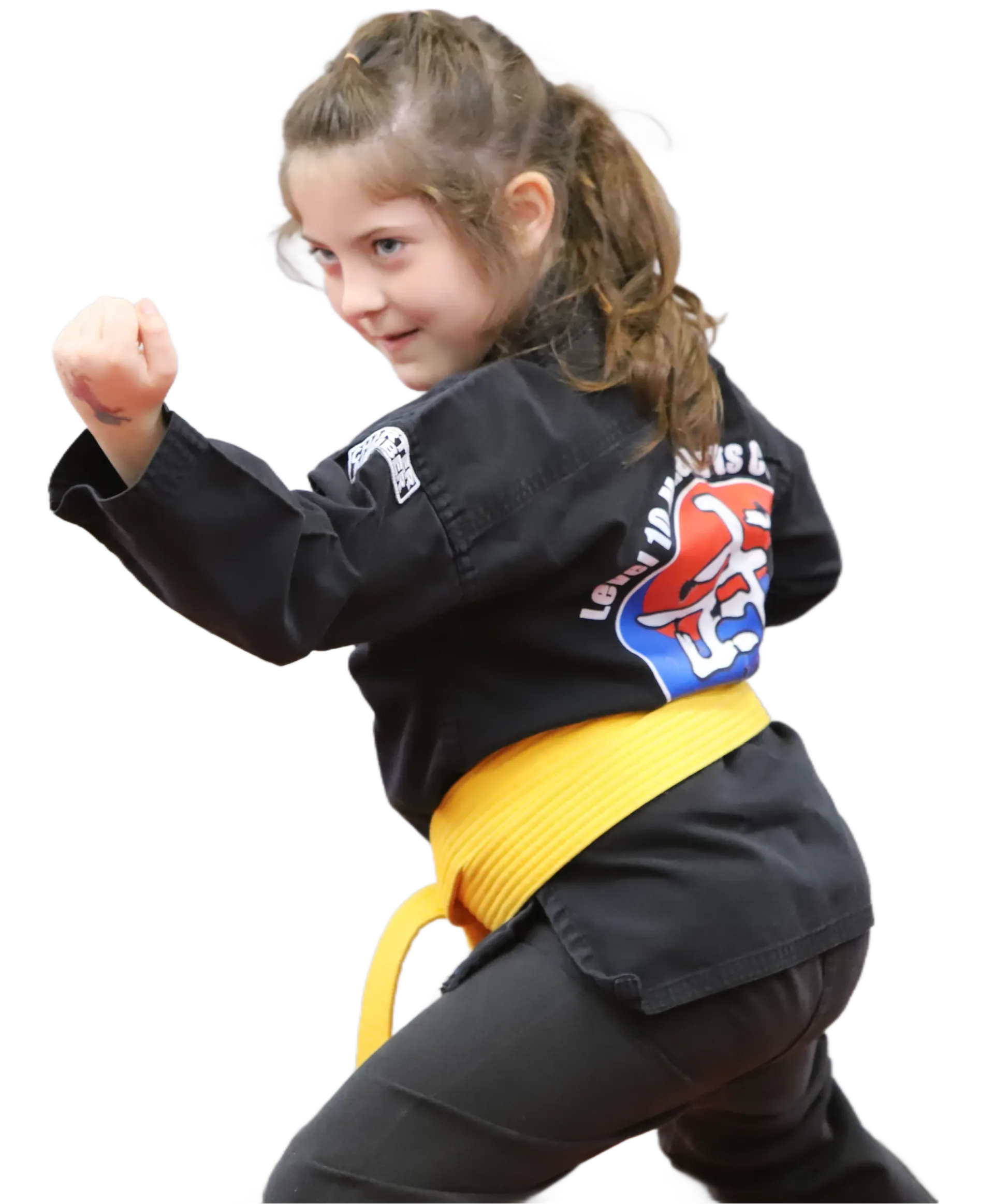 Child in a black martial arts uniform with a yellow belt, posing in a punching stance on a white background