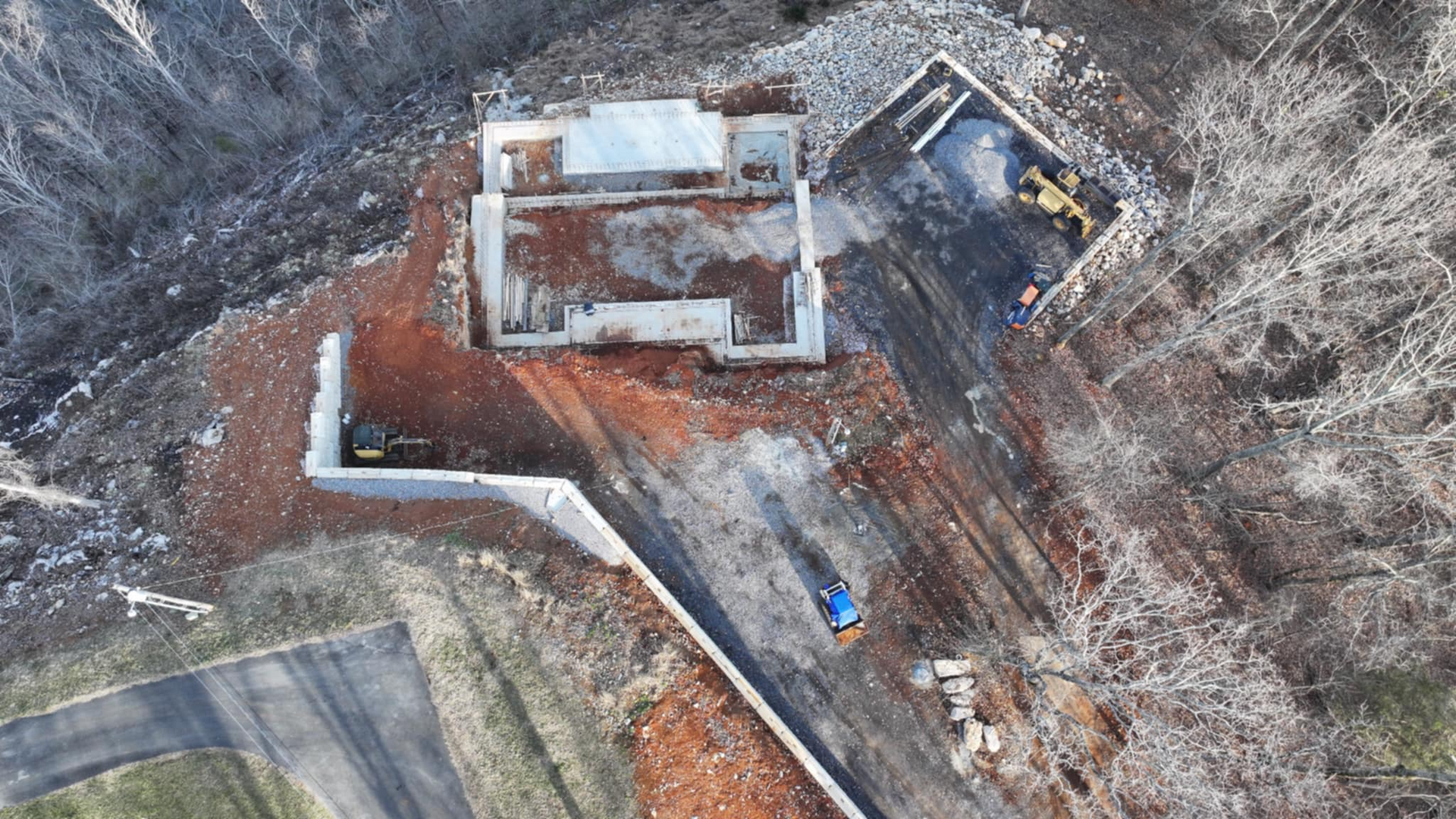 An aerial view of a construction site with a building under construction