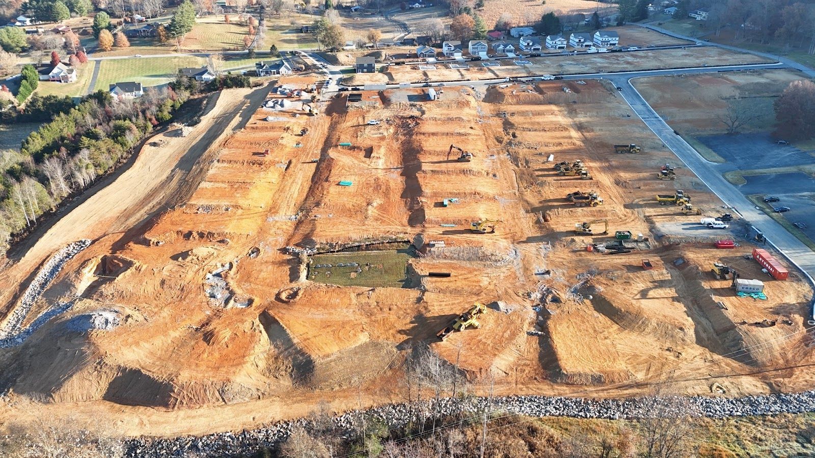 An aerial view of a construction site with a lot of dirt.