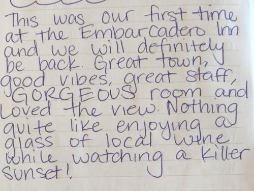 A handwritten note on a piece of paper that says