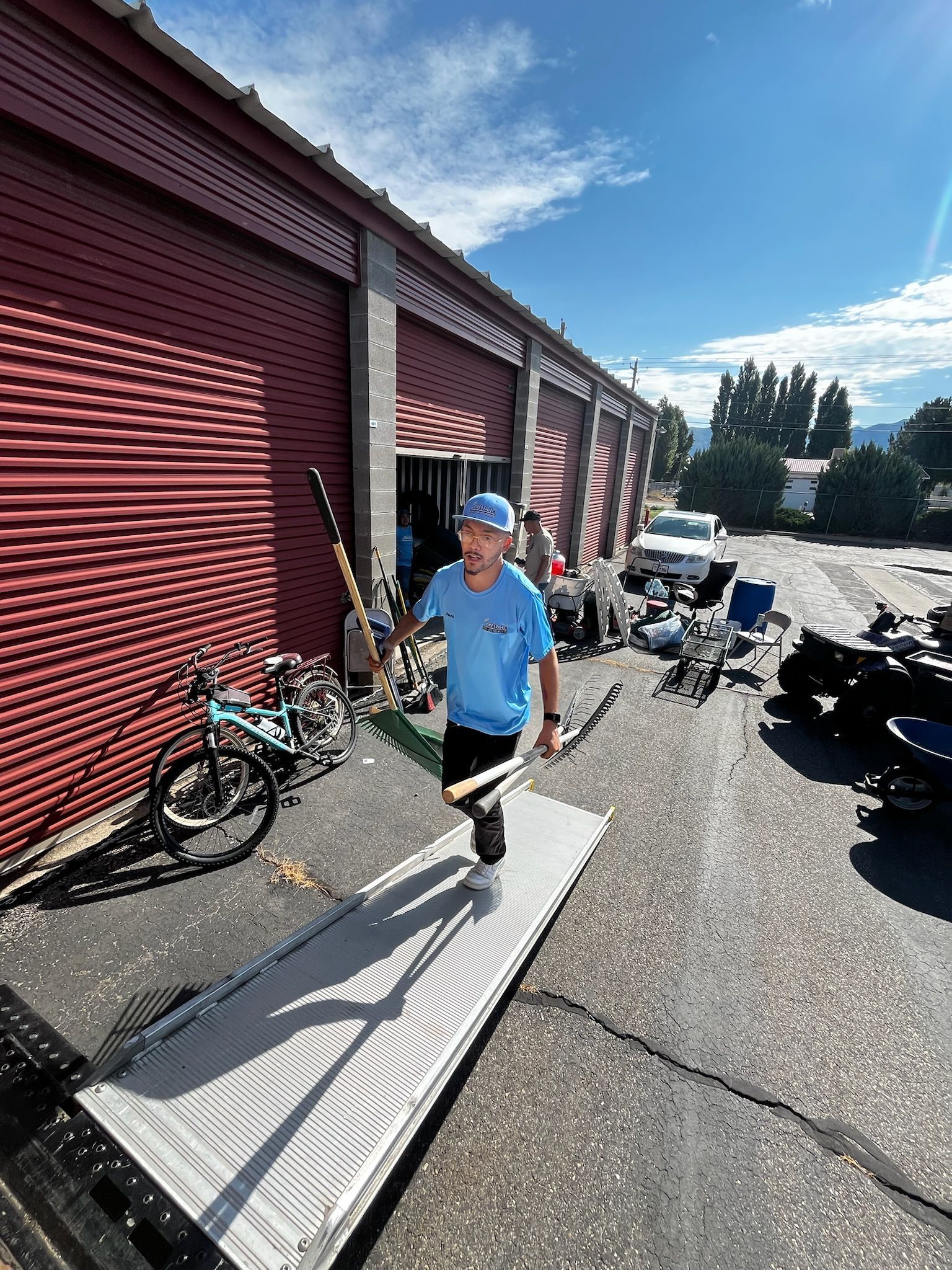 A man is walking on a ramp in front of a building.