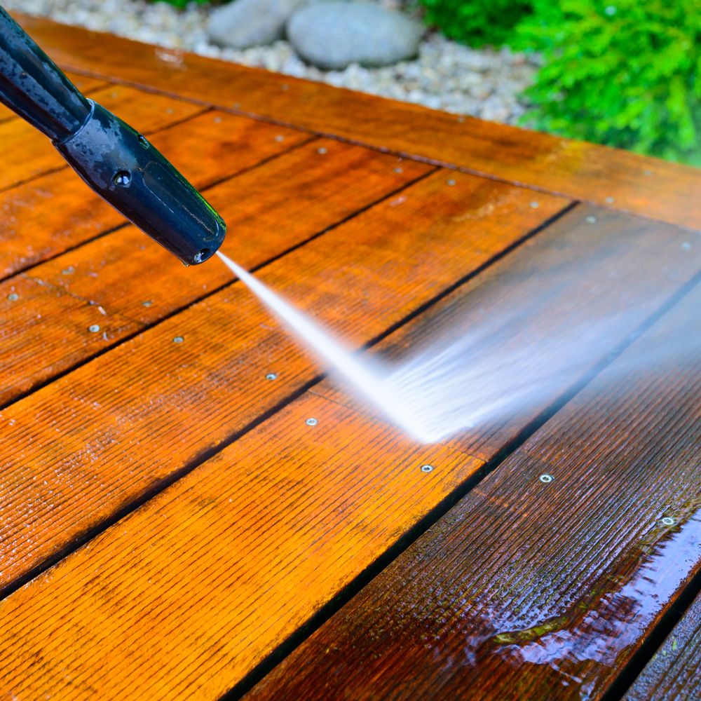 Professional Worker Cleaning Deck