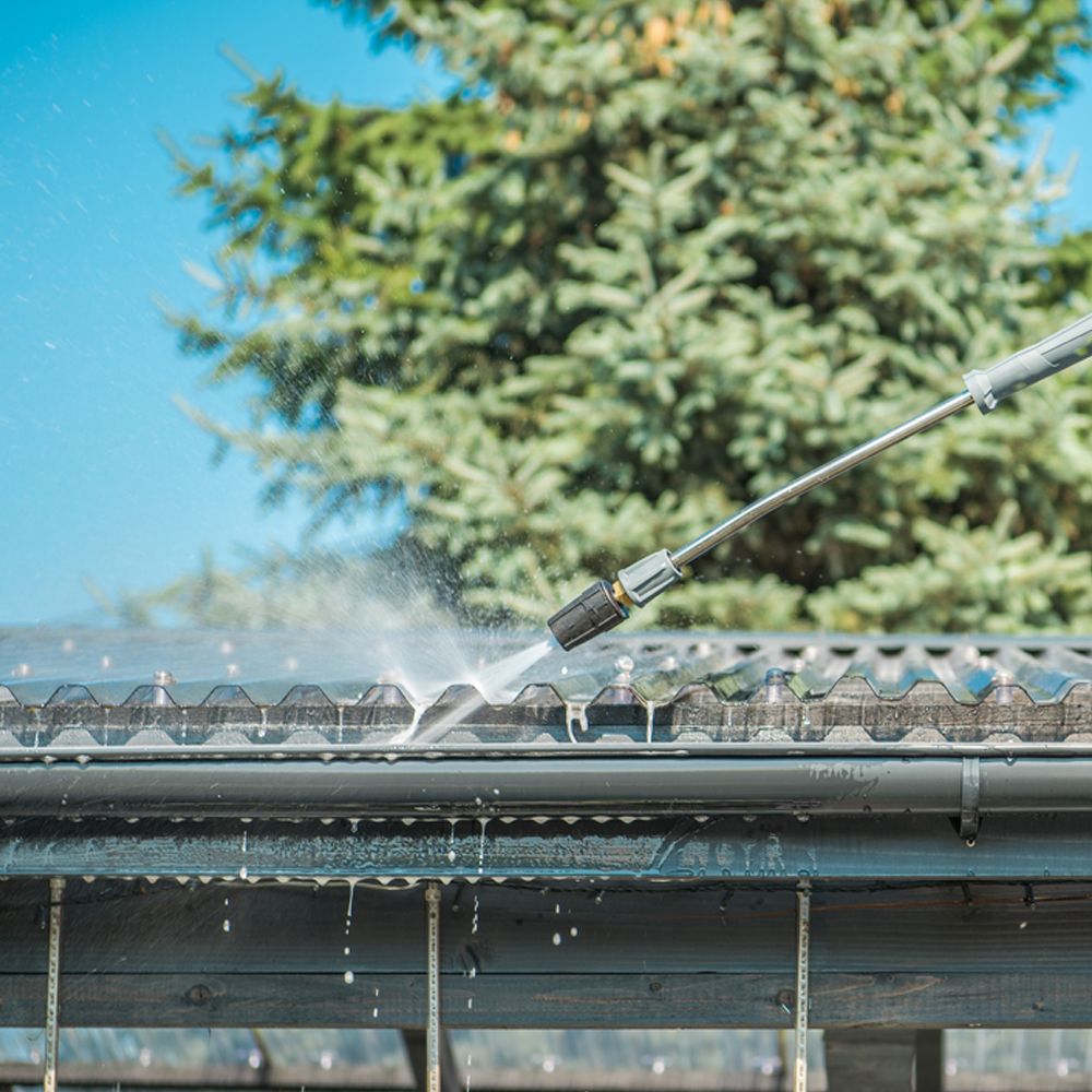 Professional Worker Cleaning Gutter