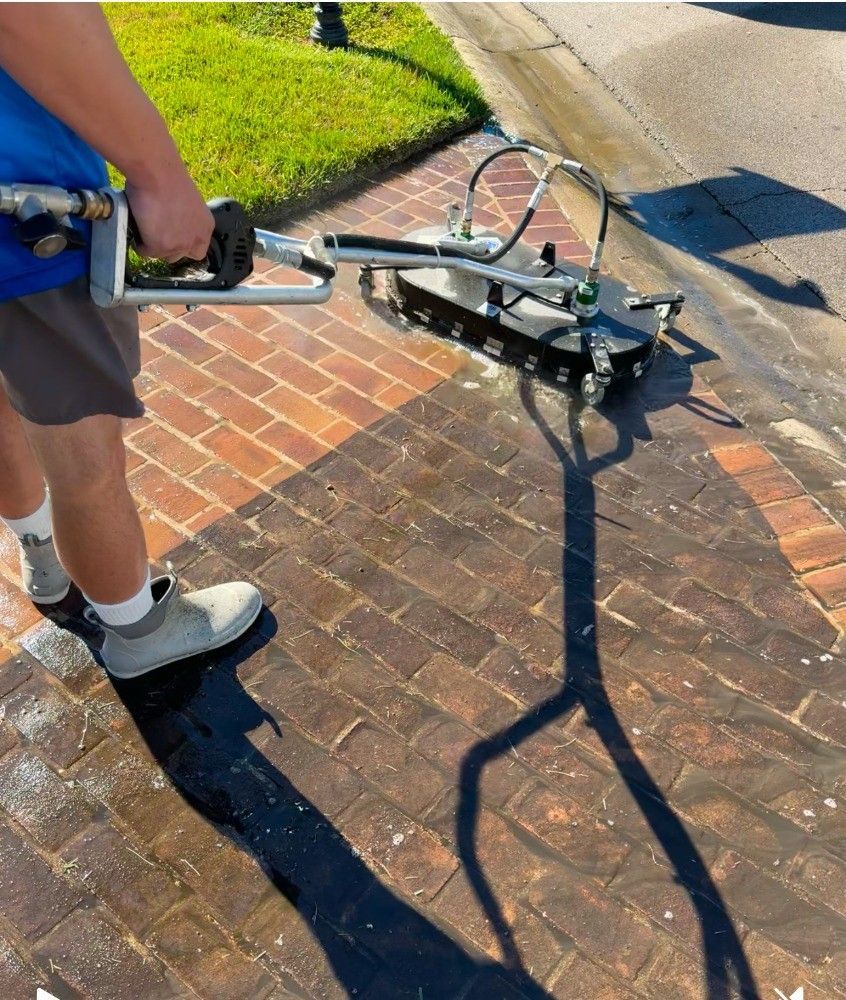 Professional Worker Cleaning Driveway