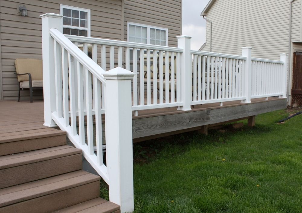white wooden balustrade around decking and steps