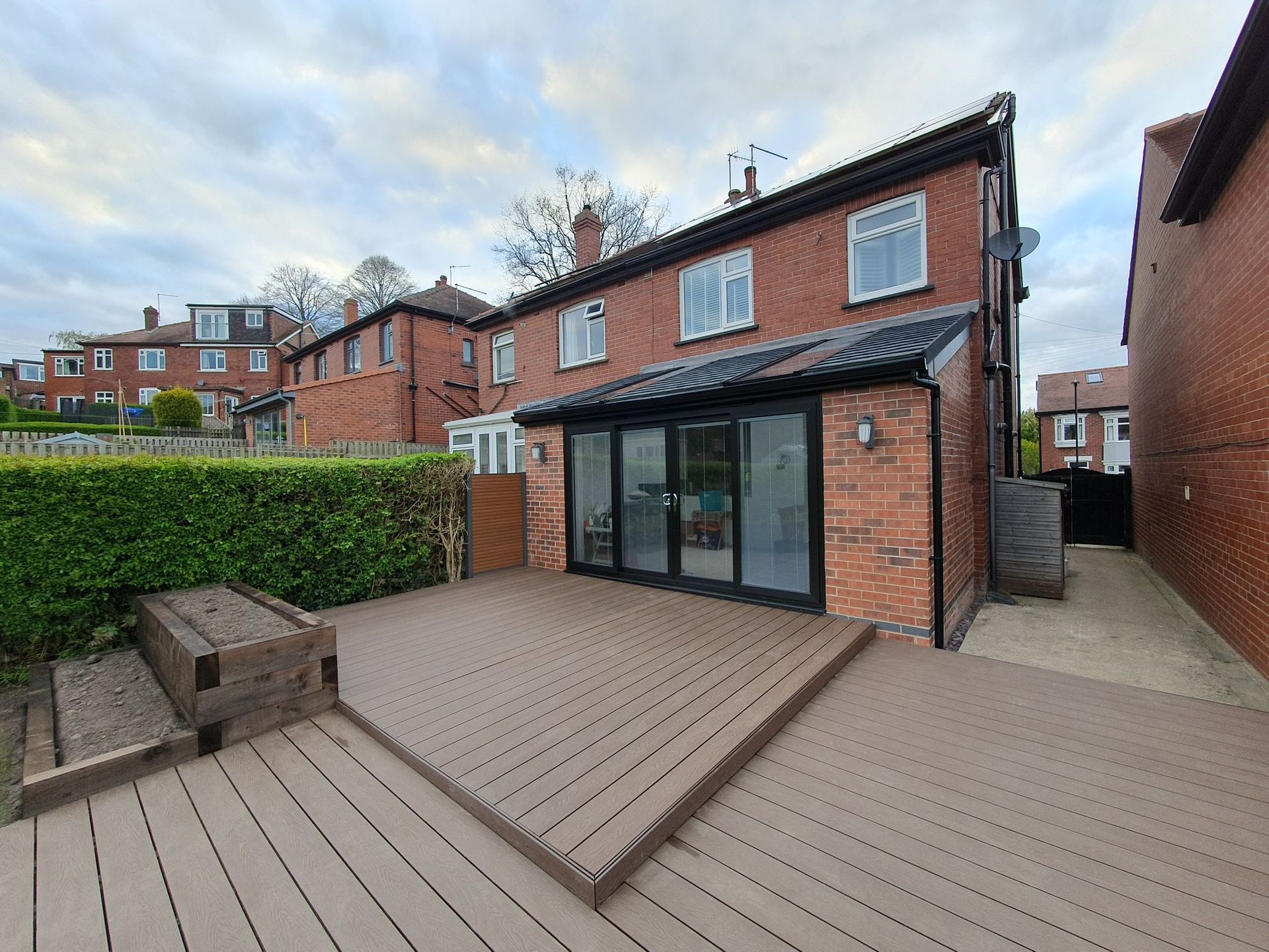 Decking Sheffield garden decking design merging composite decking with sleeper raised beds