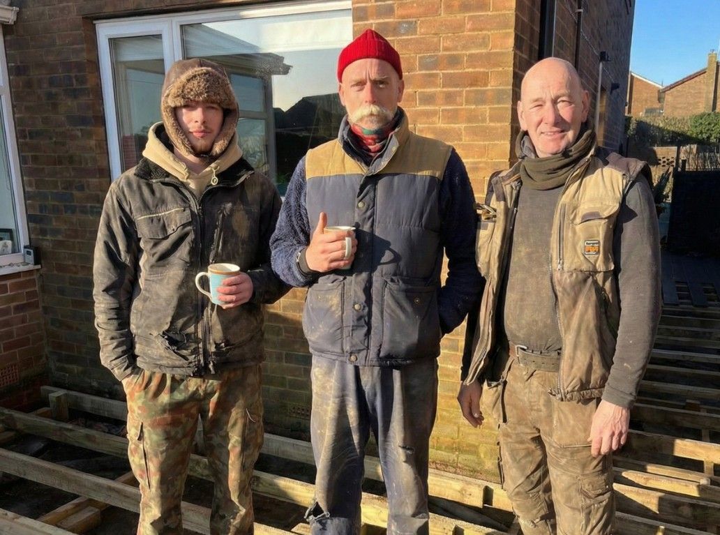 Richard, Ebberson and Mark of Decking Sheffield standing on a timber deck sub-frame on a job in Sheffield