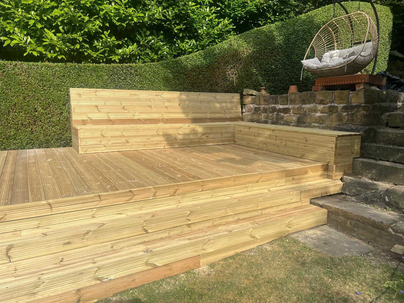 Decking Sheffield timber deck with built in benches. Seating lifts off for storage beneath.