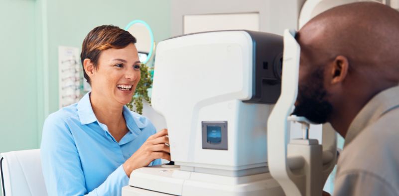The doctor is examining the patient's eye