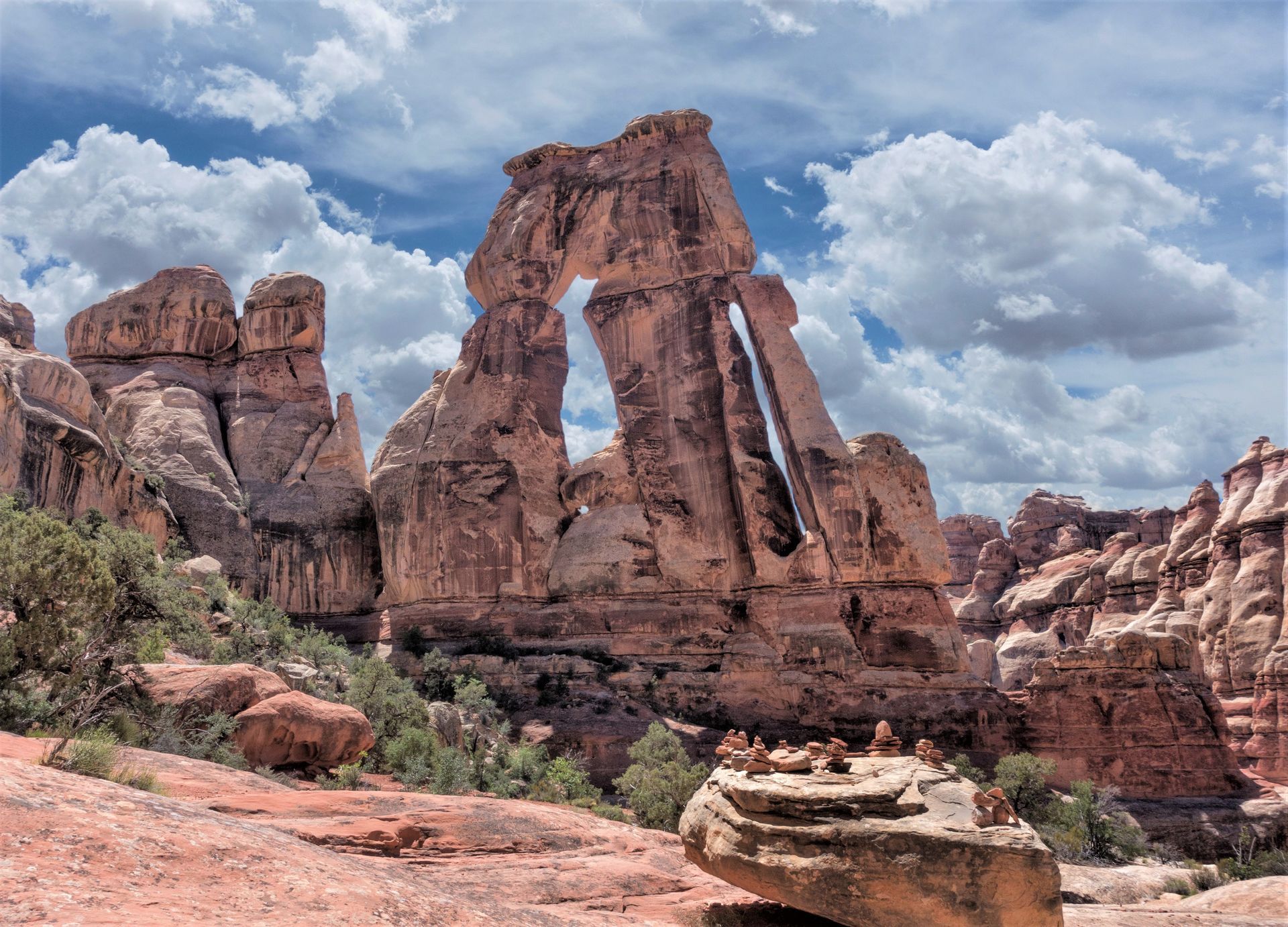 Druid arch standing tall against a partly cloudy sky.