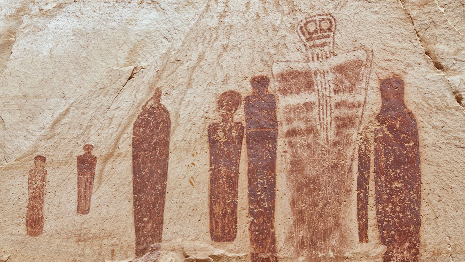 Ancient pictographs on a sandstone wall.