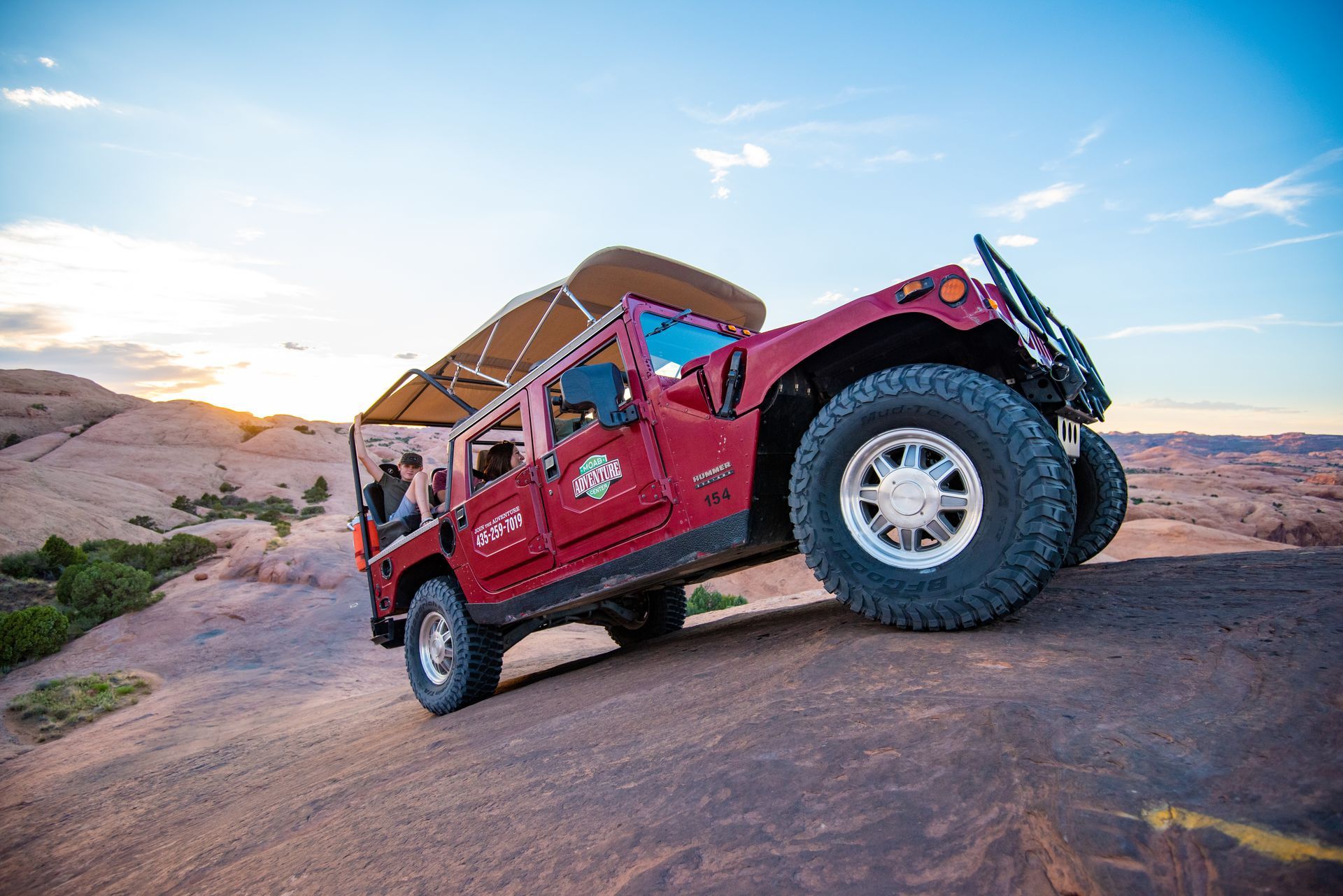 A Hummer climbs up slickrock terrain on the Hell's Revenge Trail.