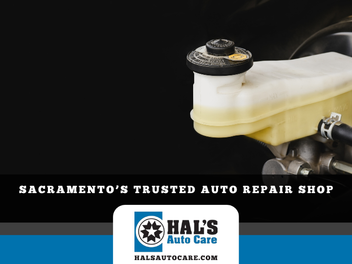 Brake fluid reservoir in a car engine bay, ad for Hal's Auto Care, a Sacramento auto repair shop. | Hal's Auto Care