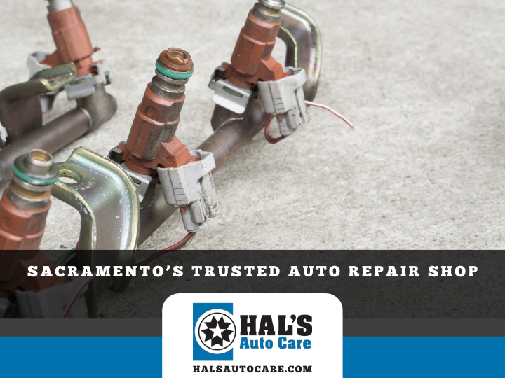 Fuel injectors in a shop setting, with Hal's Auto Care logo.