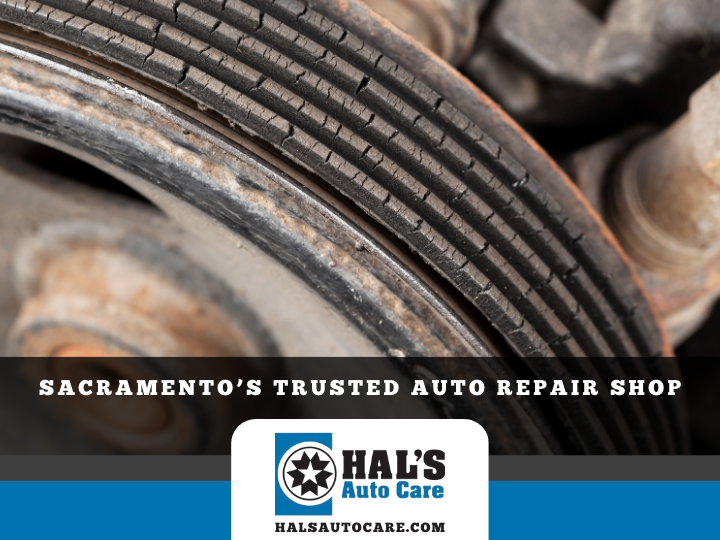 Close-up of a cracked serpentine belt with Hal's Auto Care logo at the bottom.