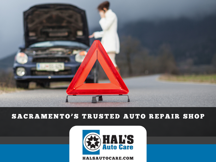 A woman with a broken-down car calls for help. A red warning triangle on the road. Sacramento auto repair logo. | Hal's Auto Care