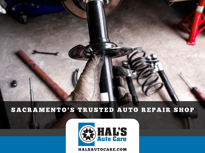 Mechanic working on car suspension with logo: Hal's Auto Care, Sacramento's trusted repair shop.