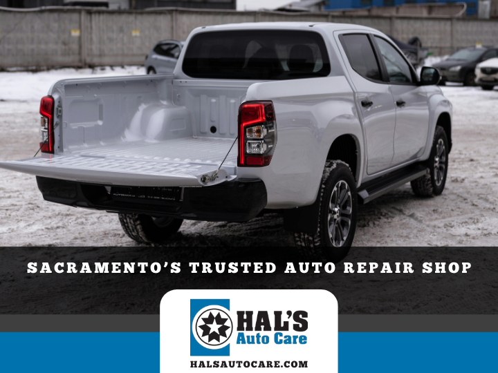 White pickup truck with open bed, in snowy setting. Hal's Auto Care logo displayed below. | Hal's Auto Care
