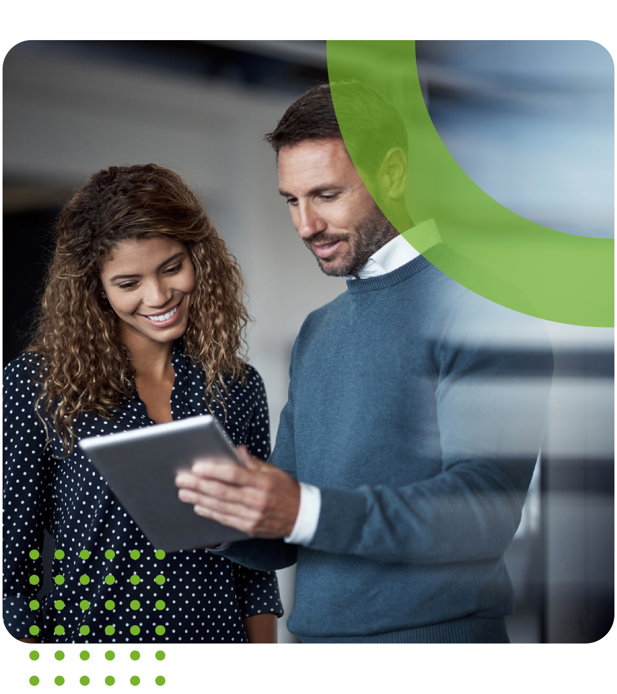 A man and a woman are looking at a tablet together.