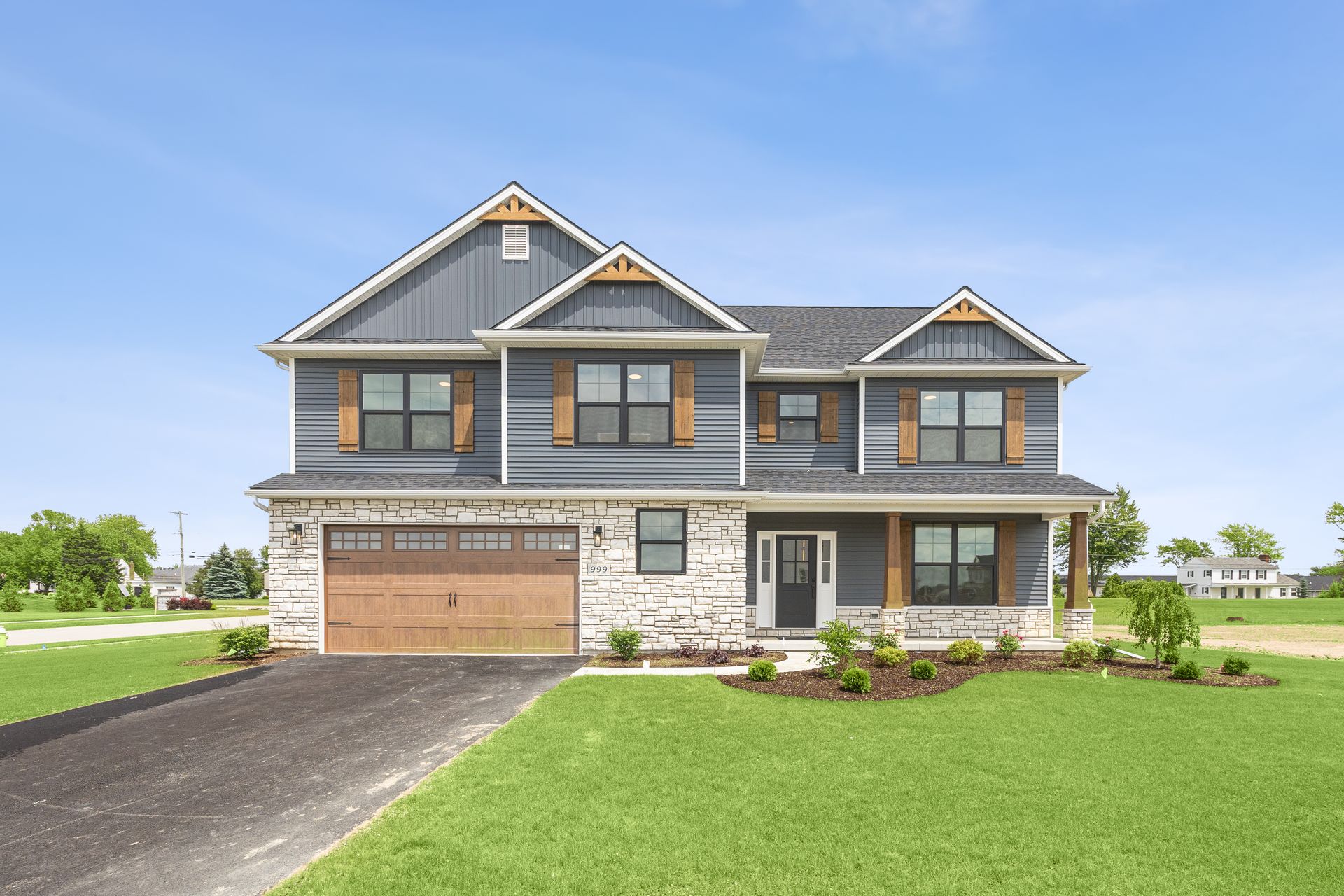 A large house with a large lawn in front of it.