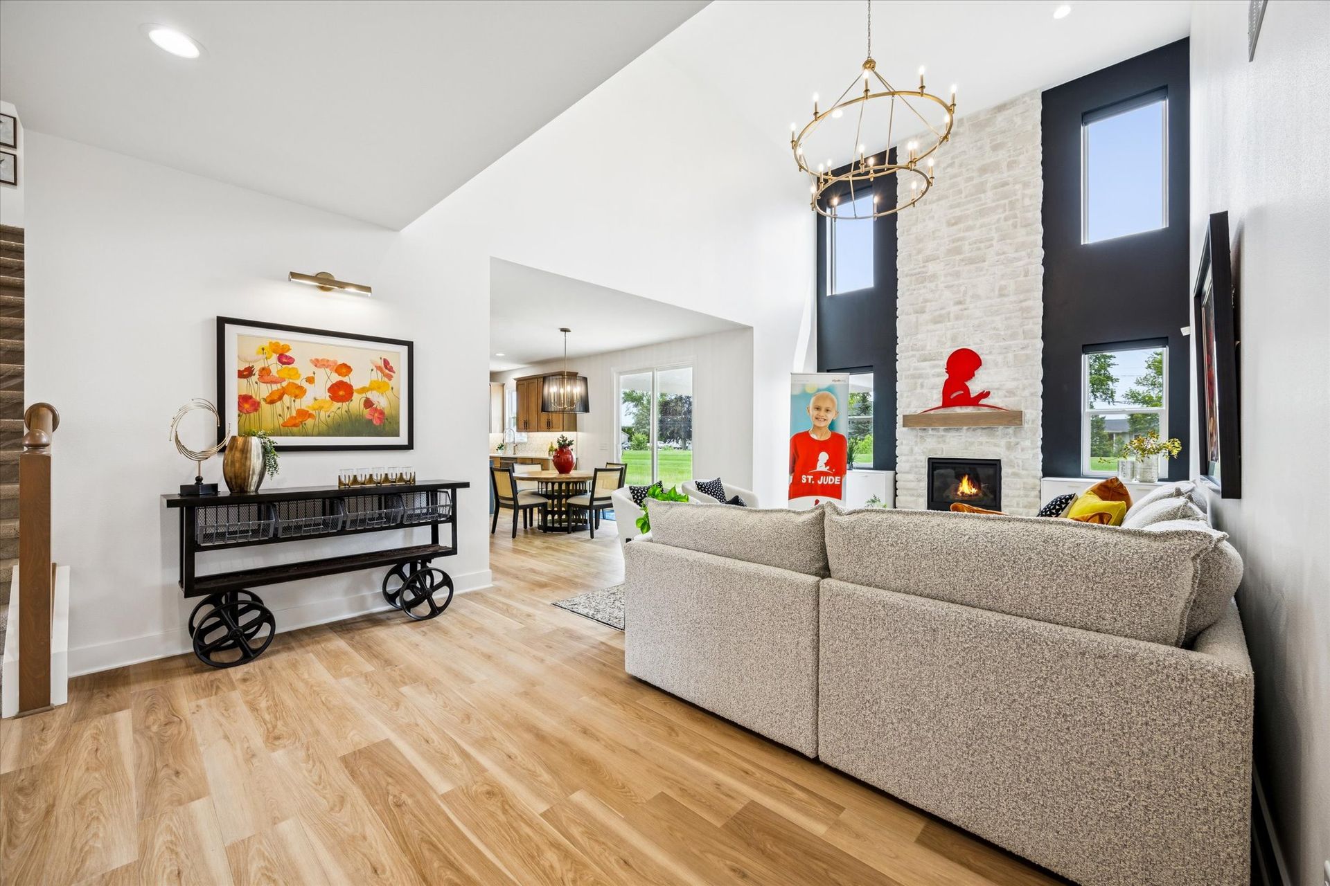 A living room with a couch and a fireplace in a house.