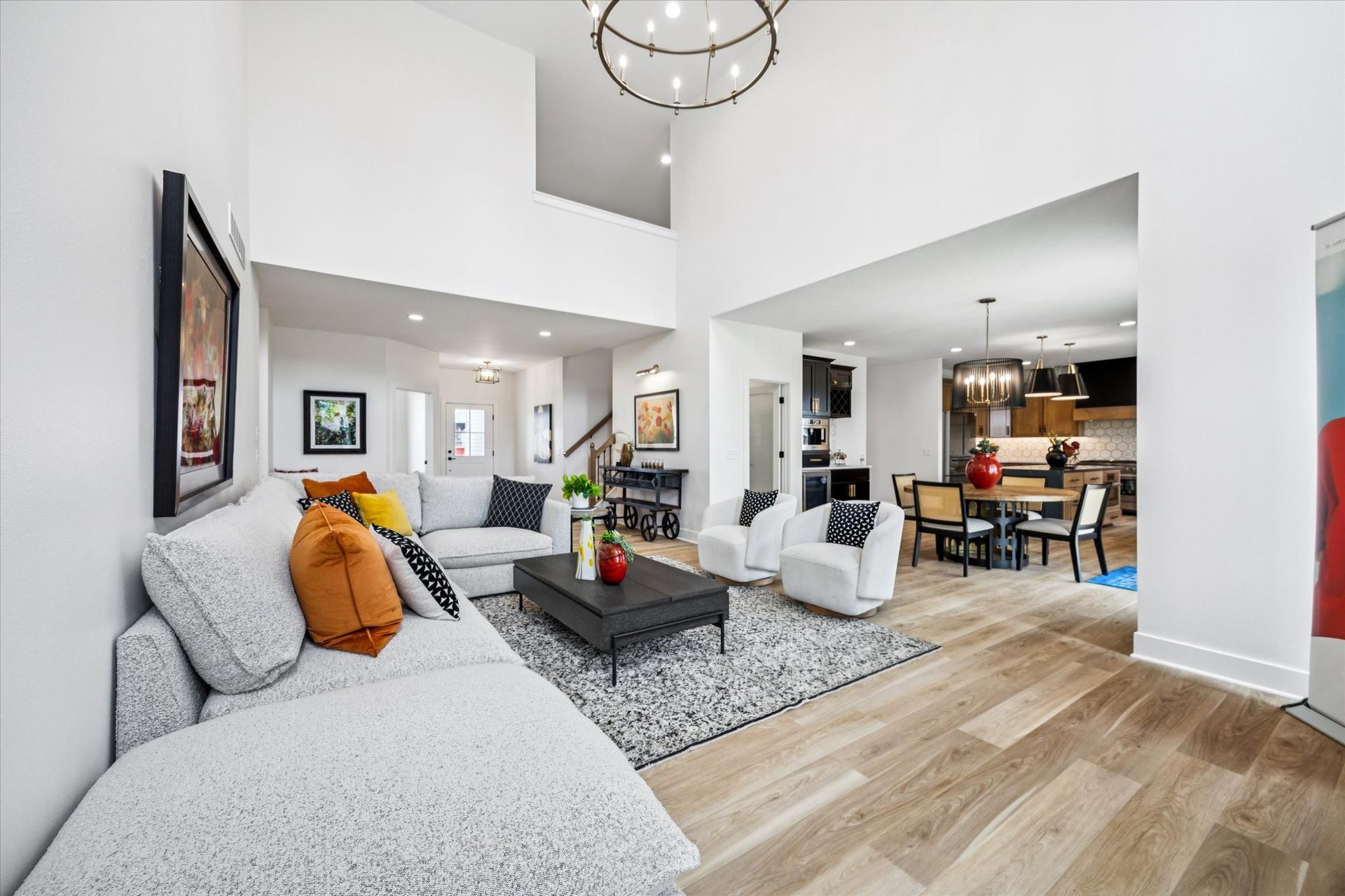 A living room filled with furniture and a chandelier.