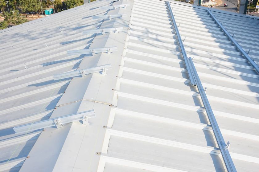 Gutter system for a metal roof