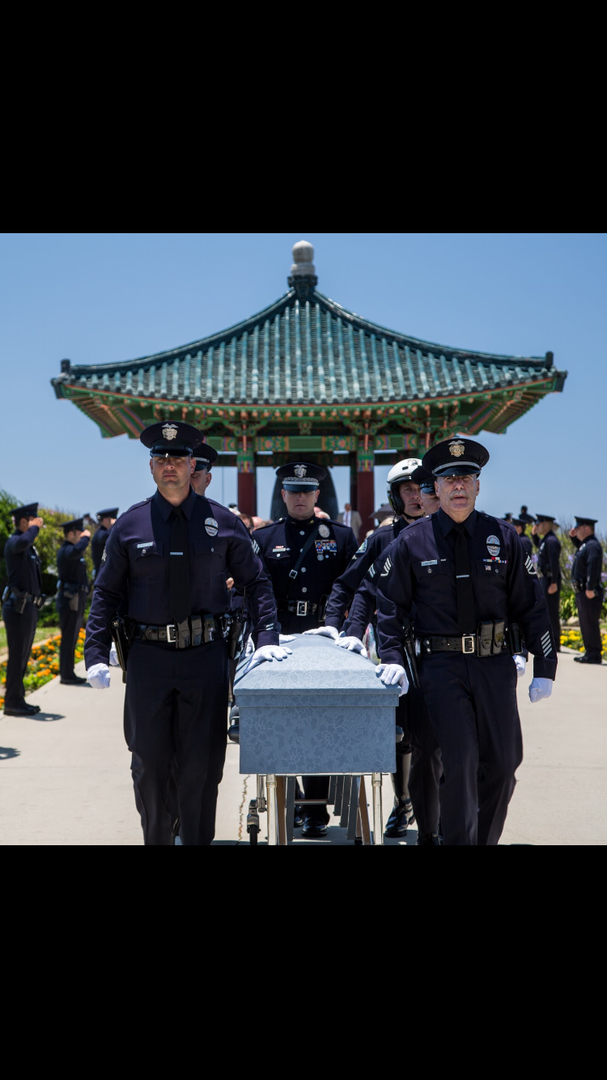 Uniformed officers carry a casket outdoors near a traditional pavilion during a solemn memorial service.