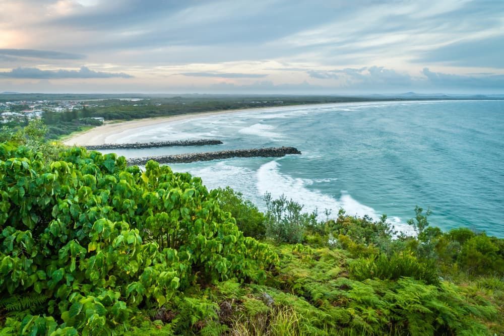 A View of A Beach from A Cliff Overlooking the Ocean — Lismore Floor Sanding in Evans Head, NSW